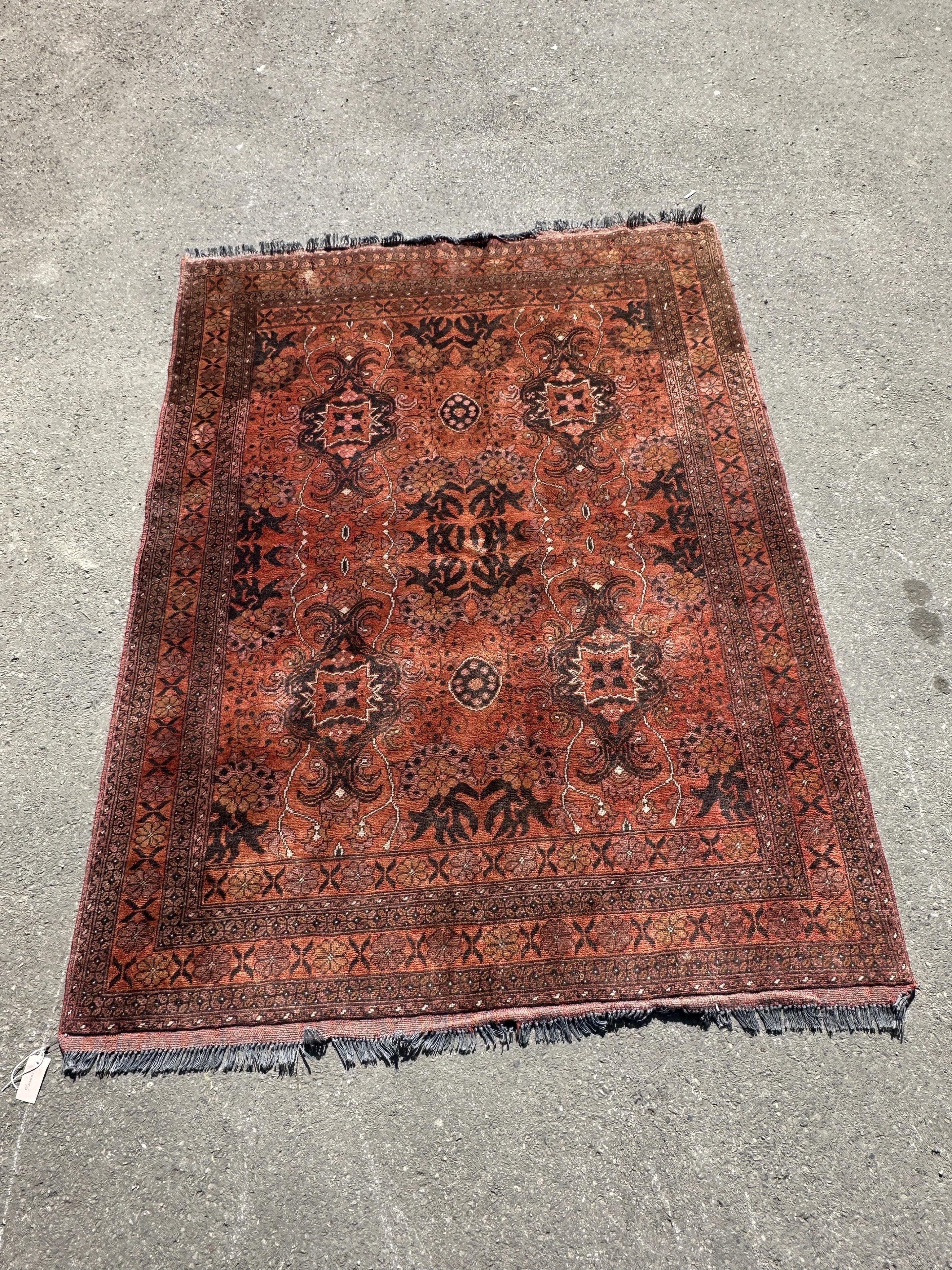 A Belouch red ground rug, 190 x 150cm.